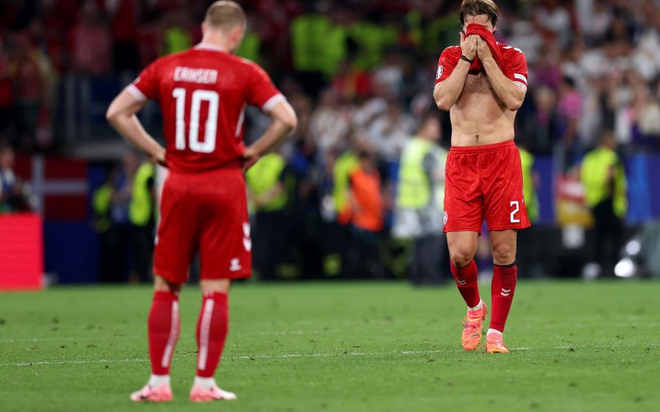 Joachim Andersen of Denmark looks dejected after the team's defeat and elimination from EURO 2024