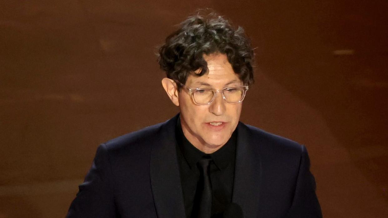 HOLLYWOOD, CALIFORNIA - MARCH 10: (L-R) Jonathan Glazer accepts the Best International Feature Film award for "The Zone of Interest" onstage during the 96th Annual Academy Awards at Dolby Theatre on March 10, 2024 in Hollywood, California. (Photo by Kevin Winter/Getty Images)