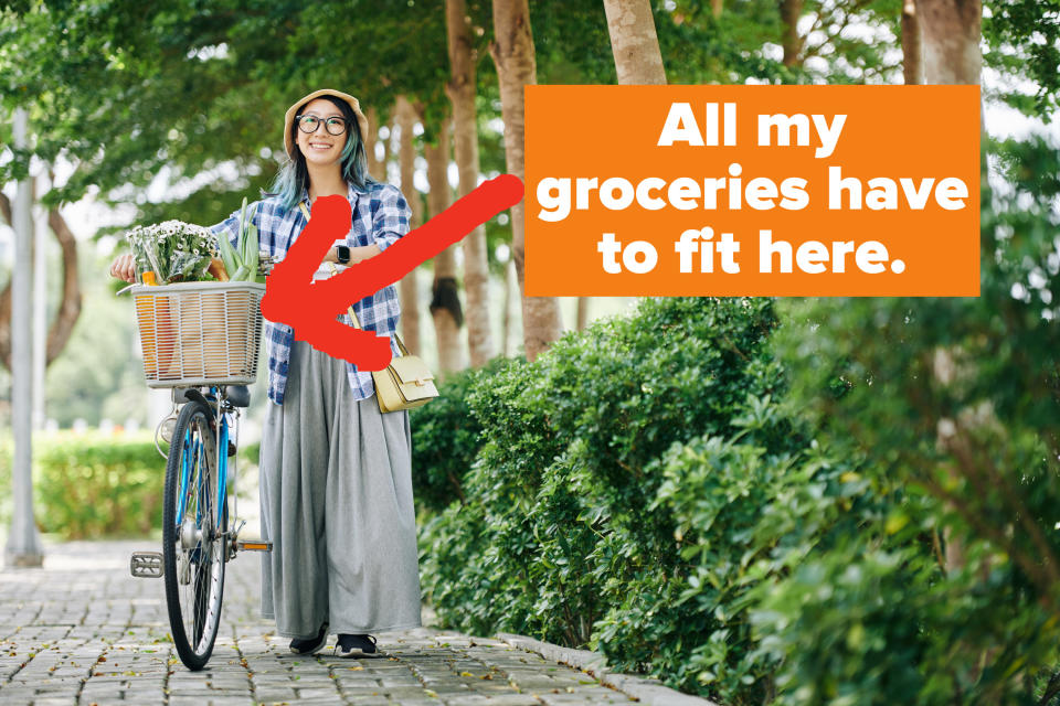 woman pushing a bicycle with groceries in the basket with the words "All my groceries have to fit in here"