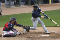 Seattle Mariners' Mitch Haniger (17) strikes out swinging during the eighth inning of a baseball game against the Minnesota Twins, Saturday, April 10, 2021, in Minneapolis. Seattle won 4-3 in the 10 inning. (AP Photo/Stacy Bengs)