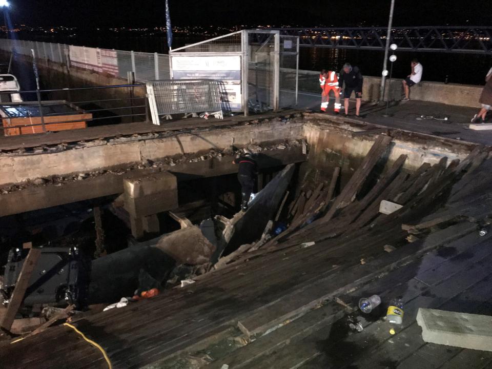 The pier buckled under the weight of revellers (Picture: EFE)