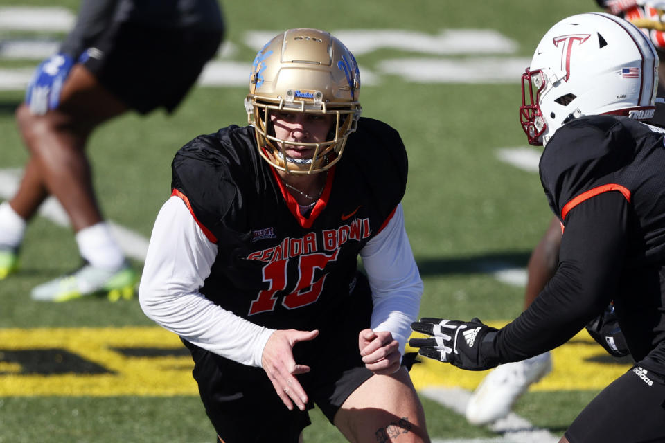 National edge Laiatu Latu of UCLA runs through drills during practice for the Senior Bowl NCAA college football game, Tuesday, Jan. 30, 2024, in Mobile, Ala. Latu is a hot NFL draft prospect two years after resuming his football career. (AP Photo/Butch Dill)