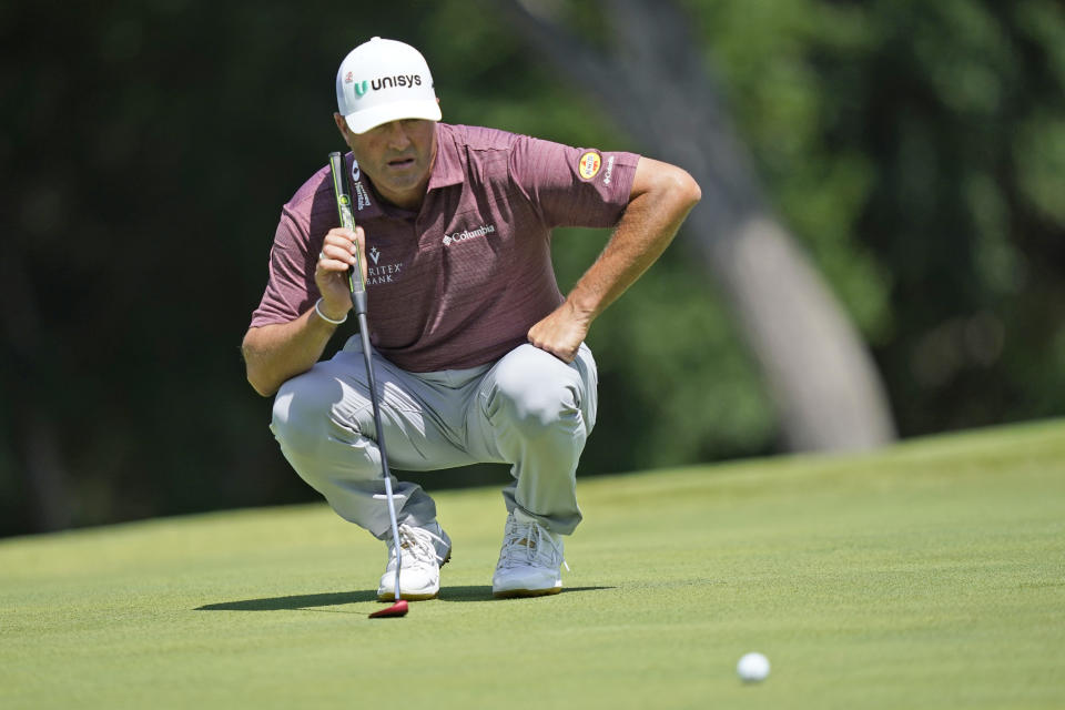 Ryan Palmer looks over his line on the first green during the third round of the Byron Nelson golf tournament in McKinney, Texas, Saturday, May 13, 2023. (AP Photo/LM Otero)