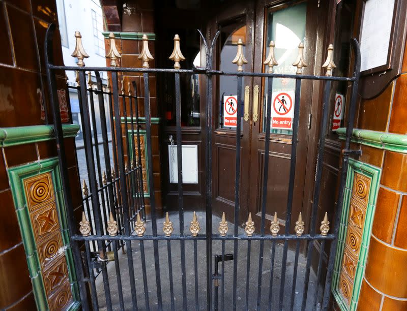 Pub doors are locked in the Temple Bar area, as bars across Ireland are to close voluntarily to curb the spread of coronavirus in Dublin