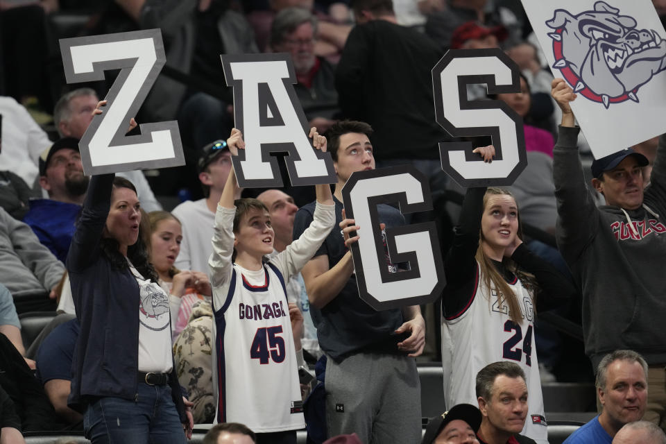 Gonzaga fans celebrate in the second half of a second-round college basketball game against TCU in the men's NCAA Tournament Sunday, March 19, 2023, in Denver. (AP Photo/David Zalubowski)