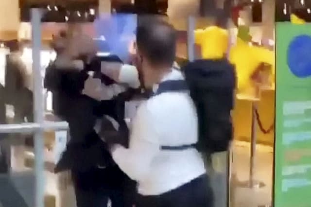 Shocking footage shows security guard and raging shopper come to blows outside Selfridges store