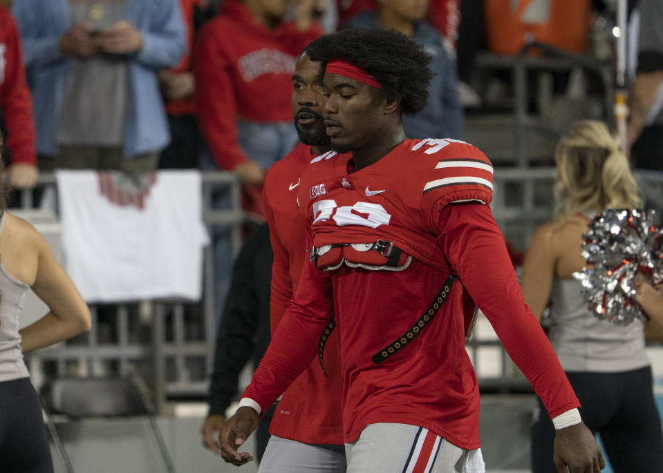 COLUMBUS, OH - SEPTEMBER 25: Ohio State Buckeyes linebacker K'Vaughan Pope #36 being escorted out of the game by Ohio State Buckeyes Director Of Player Development C.J. Barnett during the game between the Ohio State Buckeyes and the Akron Zips at Ohio Stadium in Columbus, Ohio on September 25, 2021. (Photo by Jason Mowry/Icon Sportswire via Getty Images)