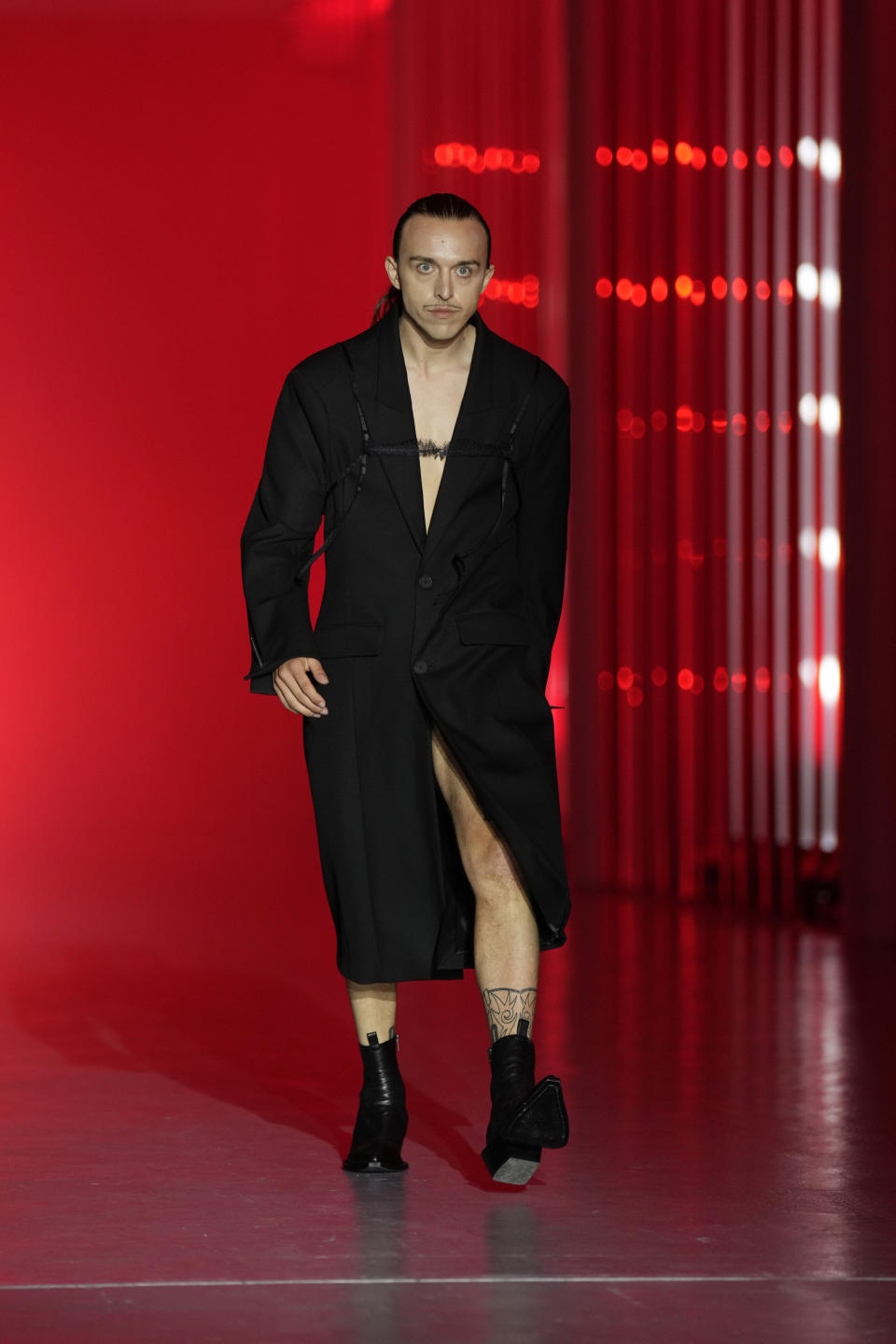 A model wears a creation as part of the Jordanluca men's and women's Spring Summer 2024 collection, unveiled during the Fashion Week in Milan, Italy, Saturday, June 17, 2023. (AP Photo/Antonio Calanni)
