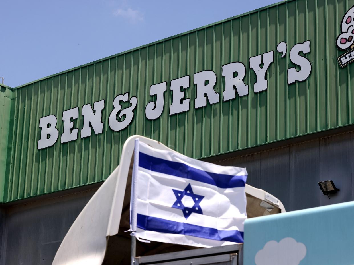 An Israeli flag is set atop a delivery truck outside US ice-cream maker Ben & Jerry's factory in Be'er Tuvia, on July 21, 2021