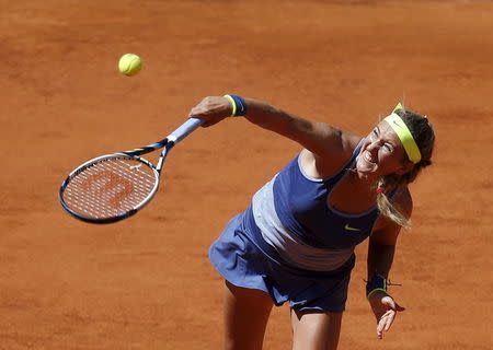 Victoria Azarenka of Belarus serves the ball to Serena Williams of the U.S. during their match at the Madrid Open tennis tournament in Madrid, Spain, May 6, 2015. REUTERS/Susana Vera