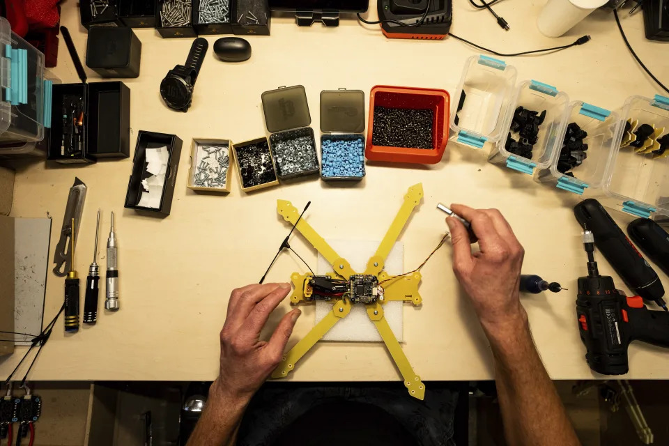 An engineer installs components in Kyiv region, Ukraine, on Wednesday, February 7, 2024. (AP Photo/Evgeniy Maloletka)