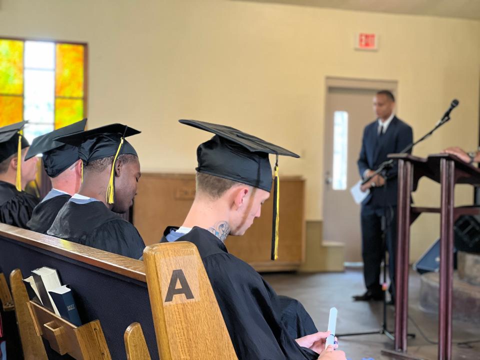 Inmates graduating with their high school diploma at at Polk Correctional Institution.