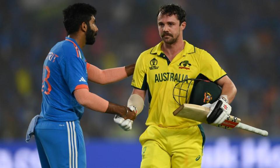 Travis Head of Australia shakes hands with Jasprit Bumrah of India as he leaves the field after being dismissed for 137 runs.