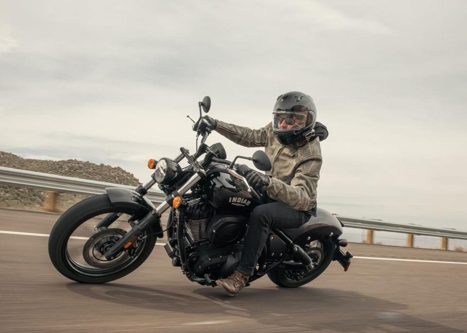 a motorcyclist riding an indian chief motorcycle