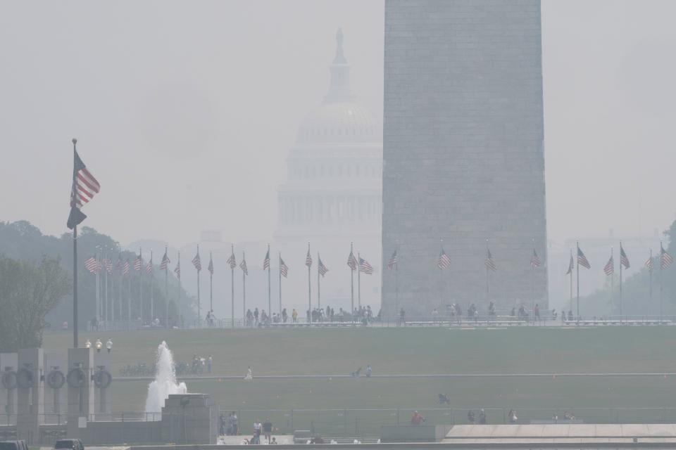 The National Mall is hazy with smoke from wildfires in Canada obscuring the view of the Capitol almost completely past the Washington Monument, as seen from the Lincoln Memorial plaza, 29 June 2023 (AP)