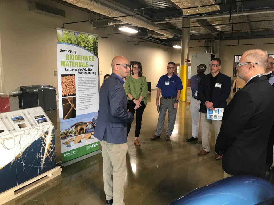 Vlastimil Kunc, group leader for polymer materials development at Oak Ridge National Laboratory's Manufacturing Demonstration Facility, describes the 3D printing process during a tour Sept. 17, 2019.