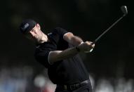 Germany's Sebastian Heisele plays a shot on the first hole during the final round of the Abu Dhabi Championship golf tournament in Abu Dhabi, United Arab Emirates, Sunday, Jan. 19, 2020. (AP Photo/Kamran Jebreili)