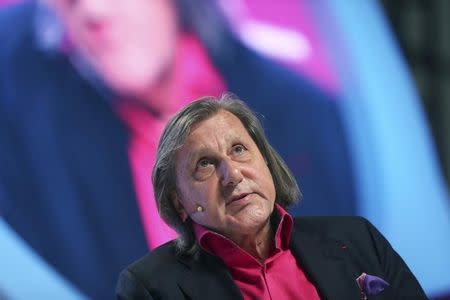 FILE PHOTO: Former world No.1 professional tennis player Ilie Nastase of Romania speaks during the Doha GOALS forum in Doha December 11, 2013. REUTERS/Fadi Al-Assaad