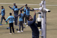 A worker installs security cameras at Gaddafi stadium as preparation for the upcoming series against Bangladesh in Lahore, Pakistan, Tuesday, Jan. 21, 2020. Pakistan will play three Twenty20 series against Bangladesh, starting from Jan. 24, at Lahore. (AP Photo/K.M. Chaudary)