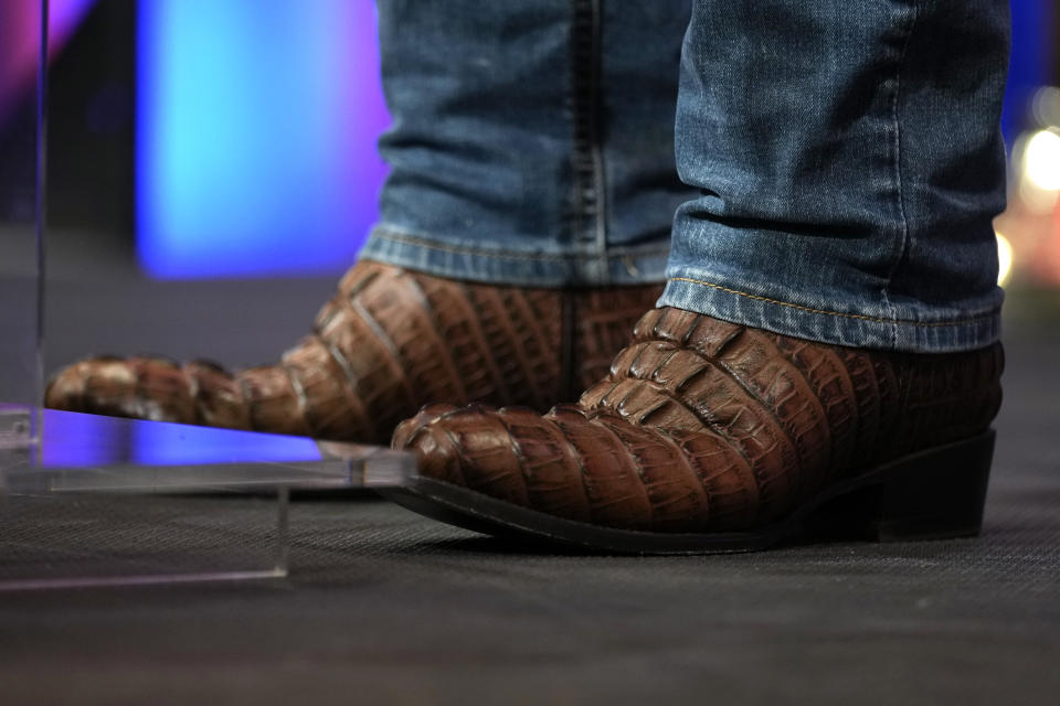 Florida Gov. Ron DeSantis' boots are seen as he speaks at a fundraising picnic for U.S. Rep. Randy Feenstra, R-Iowa, Saturday, May 13, 2023, in Sioux Center, Iowa. (AP Photo/Charlie Neibergall)