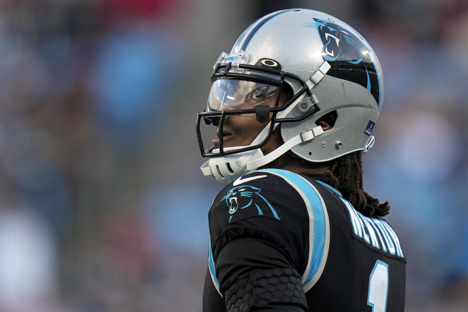 Carolina Panthers quarterback Cam Newton watches during the second half of an NFL football game against the Tampa Bay Buccaneers Sunday, Dec. 26, 2021, in Charlotte, N.C. (AP Photo/Rusty Jones)