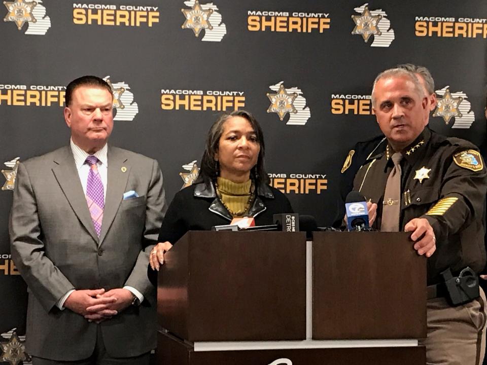 Macomb County Prosecutor Peter Lucido, far left; Sharman Davenport, president/CEO of Turning Point Inc.; and Macomb County Sheriff Anthony Wickersham listen to reporters' questions during a news conference about a prostitution and human trafficking investigation Dec. 18, 2023, at the county jail in Mount Clemens.