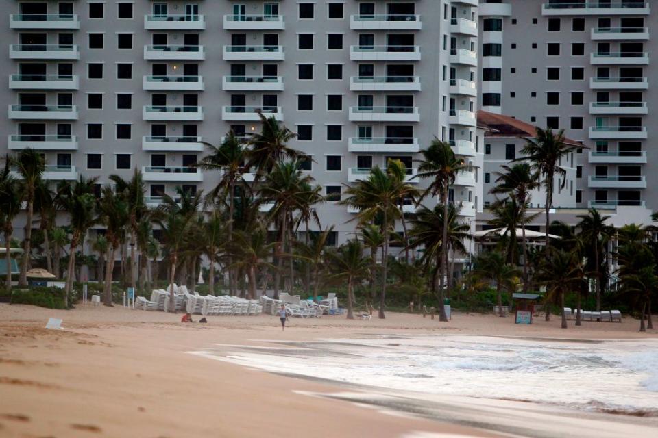 People are seen at the beach in the tourist zone of El Condado in San Juan, Puerto Rico on November 28, 2017