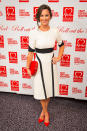 <p>Pippa paired a black and white Tabitha Webb dress with a birght red Radley clutch and matching heels for a charity event at the start of this year. <i>[Photo: PA Images]</i> </p>