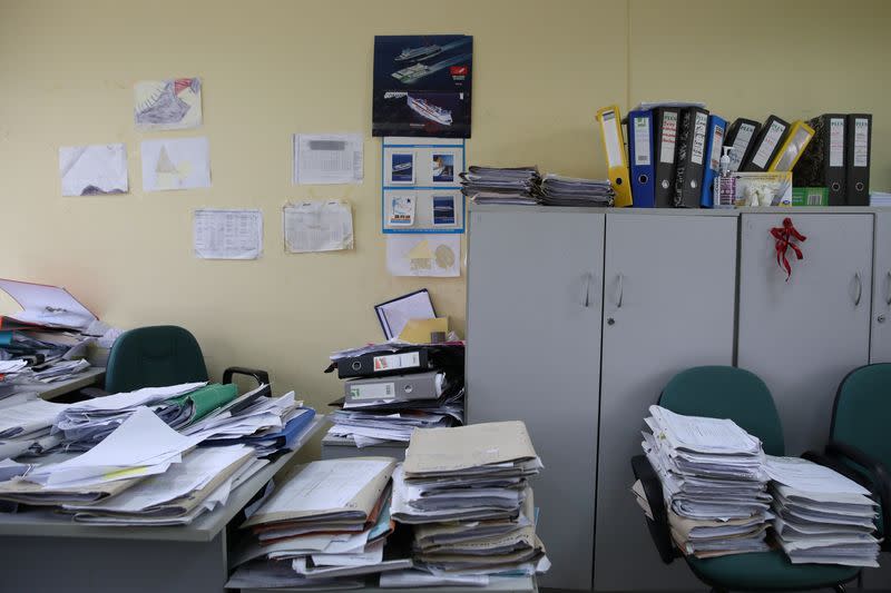 Piles of documents are seen at a Greek Manpower Employment Organisation (OAED) office near Athens