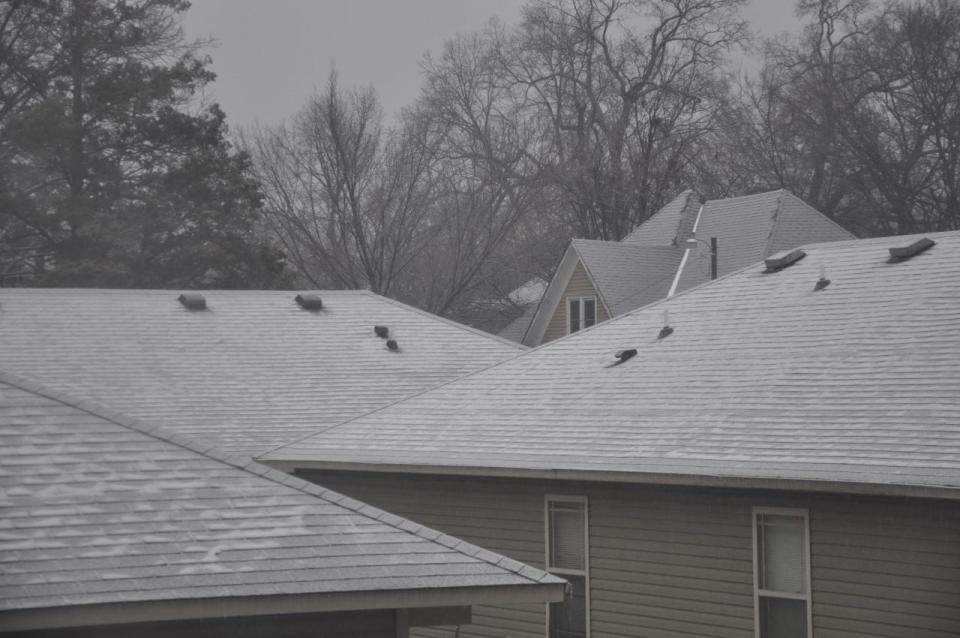 Rooftops are coated with sleet in north Fort Smith Tuesday, Jan. 31, 2023 after several rounds of freezing drizzle and ice that came with a wintry mix of weather.