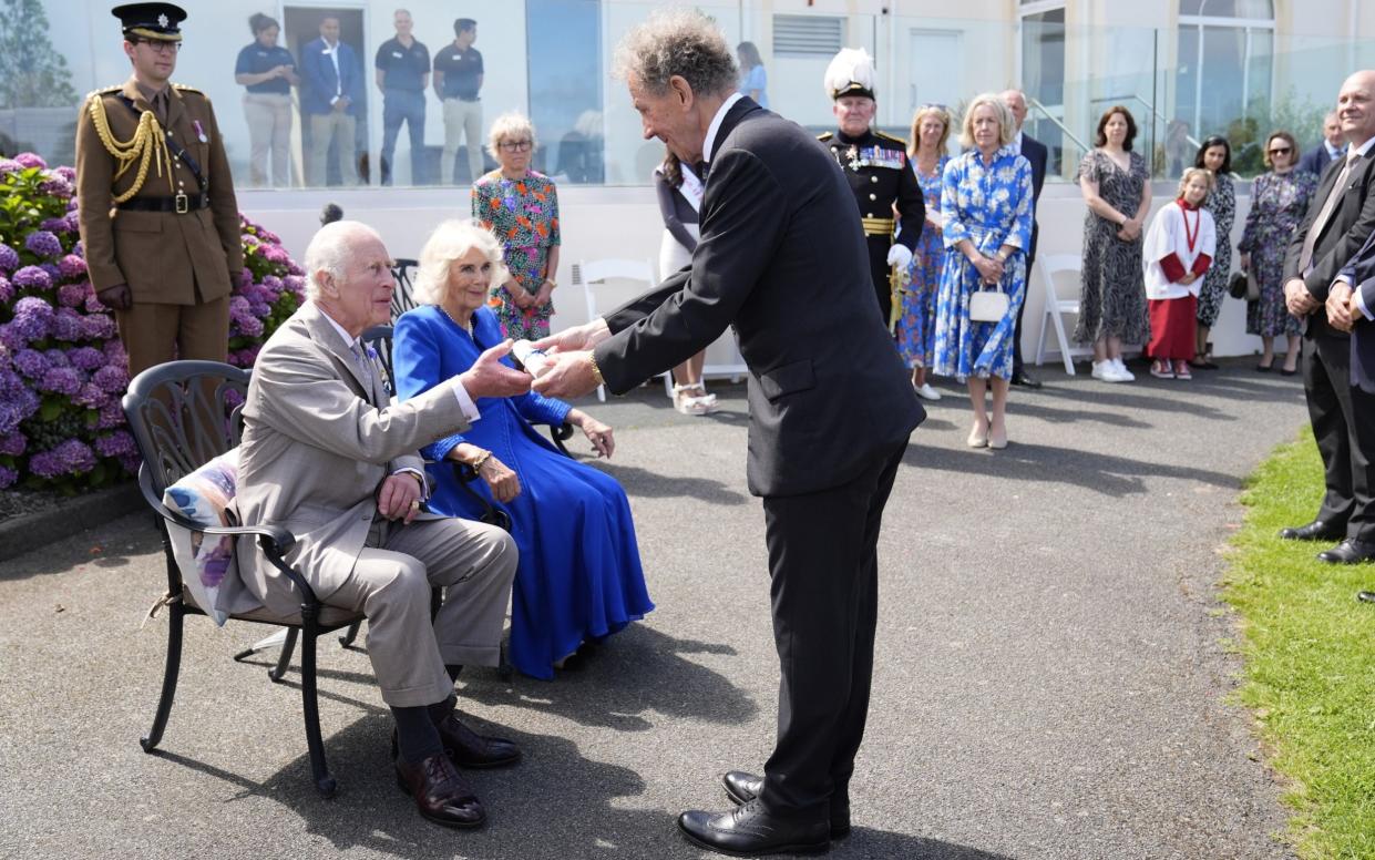 The King and Queen are presented with the loyal address from Alderney during a visit to Les Cotils at L'Hyvreus