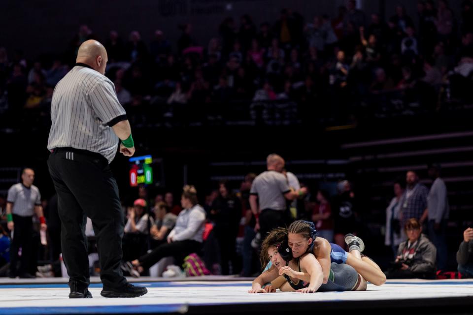 Maple Mountain’s Ellie Jensen and Salem Hills’s Paisley Nelson compete in the 5A Girls Wrestling State Championships at the UCCU Center in Orem on Thursday, Feb. 15, 2024. | Marielle Scott, Deseret News