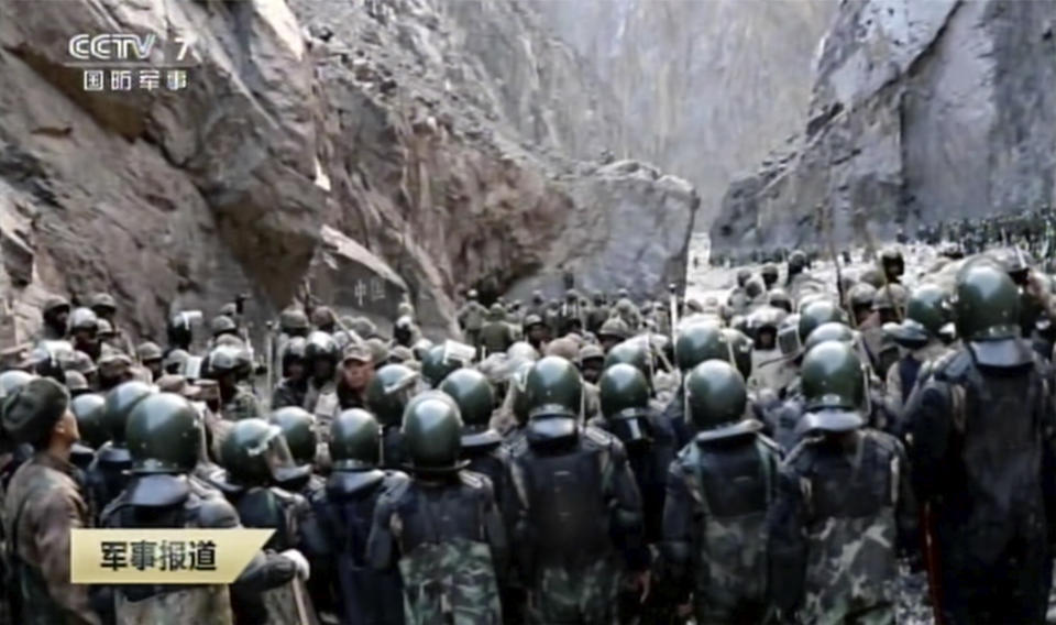 In this image taken from video footage run Feb. 19, 2021 by China's CCTV via AP Video, Indian and Chinese troops face off in the Galwan Valley on the disputed border between China and India, June 15, 2020. China's military said Friday, Feb. 19, 2021 that four of its soldiers were killed in a high-mountain border clash with Indian forces last year, the first time Beijing has publicly conceded its side suffered casualties in the deadliest incident between the Asian giants in nearly 45 years. (CCTV via AP Video)