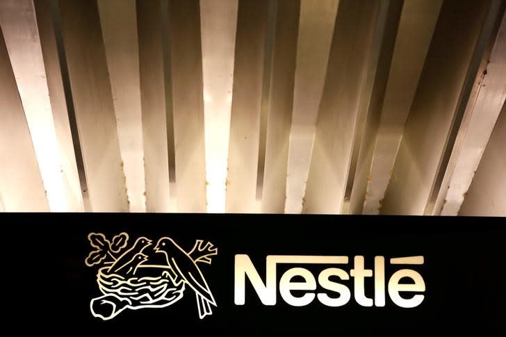 The Nestle logo is pictured on the company headquarters entrance building in Vevey, Switzerland February 18, 2016. REUTERS/Pierre Albouy/Files