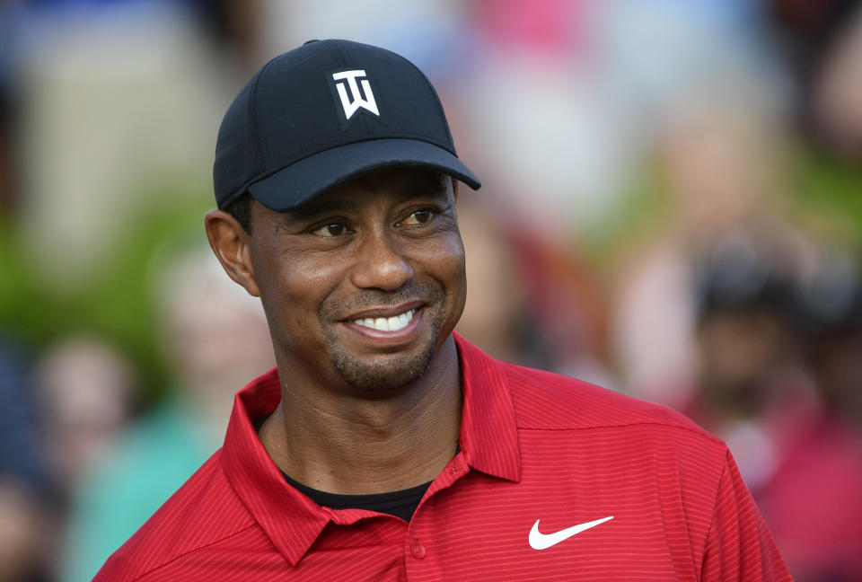 Tiger Woods stands on the 18th green after winning the Tour Championship golf tournament Sunday, Sept. 23, 2018, in Atlanta. (AP Photo/John Amis)