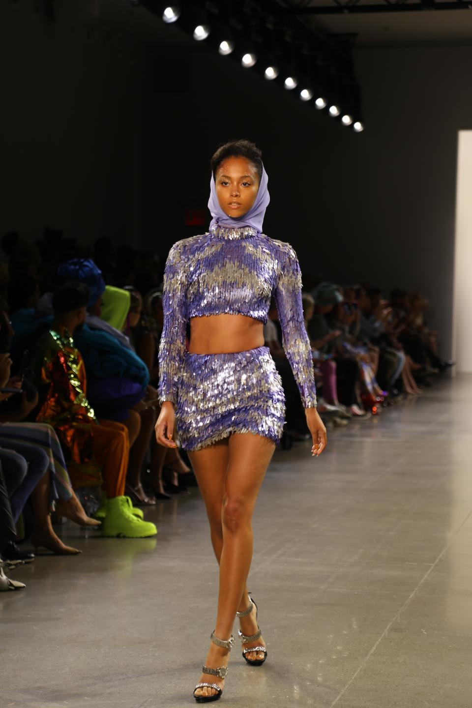 A model wears fashion from the Christian Cowan collection during Fashion Week in New York on Tuesday, Sept. 10, 2019. (AP Photo/Ragan Clark)