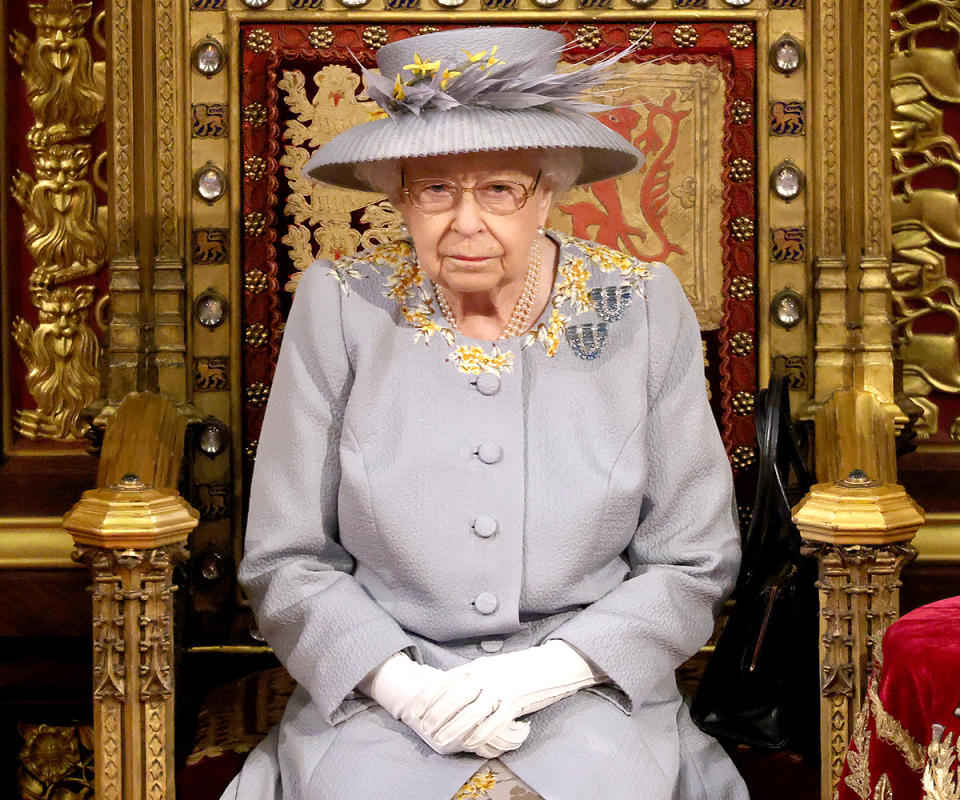 Queen Elizabeth sitting on a gold throne