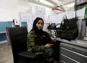 First Lieutenant in the Afghan National Army (ANA), Zainab Baqiri Shayan, 24, poses for a picture at her radio operating desk in the Ministry of Defence in Kabul, Afghanistan, October 31, 2016. REUTERS/Mohammad Ismail