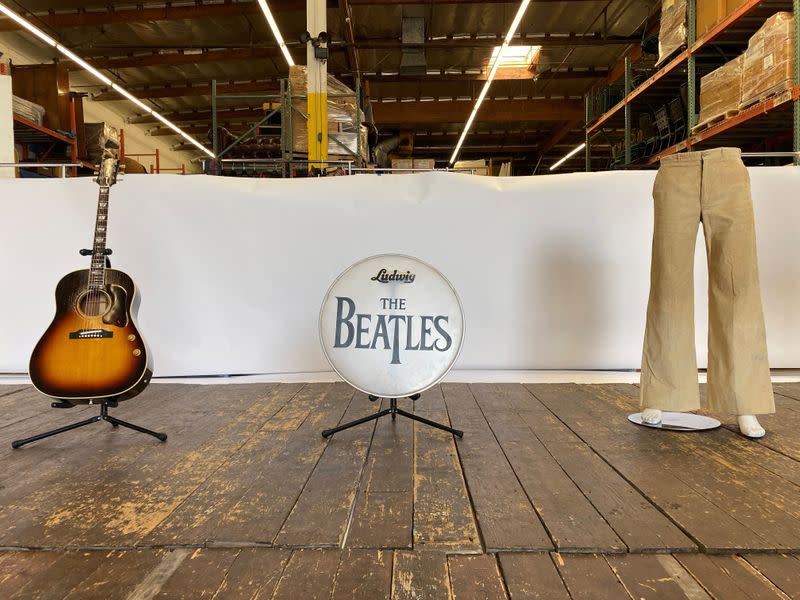 A sheet of paper with partial "Hey Jude" lyrics, written by Paul McCartney for a recording session in 1968, is displayed in a Julien's Auctions warehouse in Torrence, California