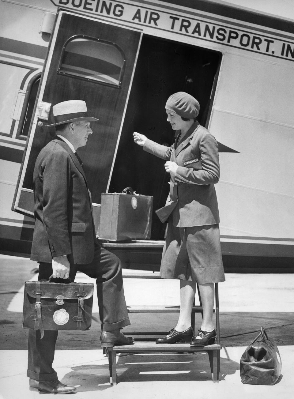 Often considered the first female flight attendant in history,&nbsp;25-year-old registered nurse Ellen Church from Iowa welcomes a traveler at the door of a Boeing 80 A&nbsp;for Boeing Air Transport&nbsp;in 1930.