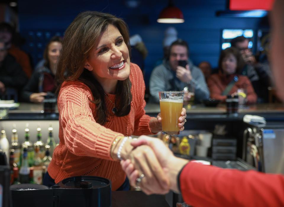Republican presidential candidate, former U.N. Ambassador Nikki Haley, greets people during an event at T-BONES on January 22, 2024 in Concord, New Hampshire.