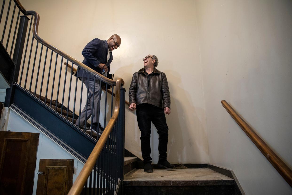 Shaun Wilson, left, founder and managing partner at Cadence, does a walk through with one of his clients, Christopher Collins, artistic director of the Detroit Jazz Festival Foundation, of the restoration of a building on Wayne State University campus to become the Gretchen C. Valade Jazz Center on Tuesday, Nov. 7, 2023.