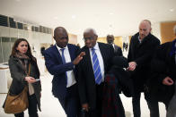 CAPTION CORRECTS SPELLING OF SURNAME Former president of the IAAF (International Association of Athletics Federations) Lamine Diack, center, arrives at the Paris courthouse, Monday, Jan. 13, 2020. One of the biggest sports corruption cases to reach court is being heard in Paris from Monday, with explosive allegations of a massive doping cover-up at the top of track and field. (AP Photo/Thibault Camus)