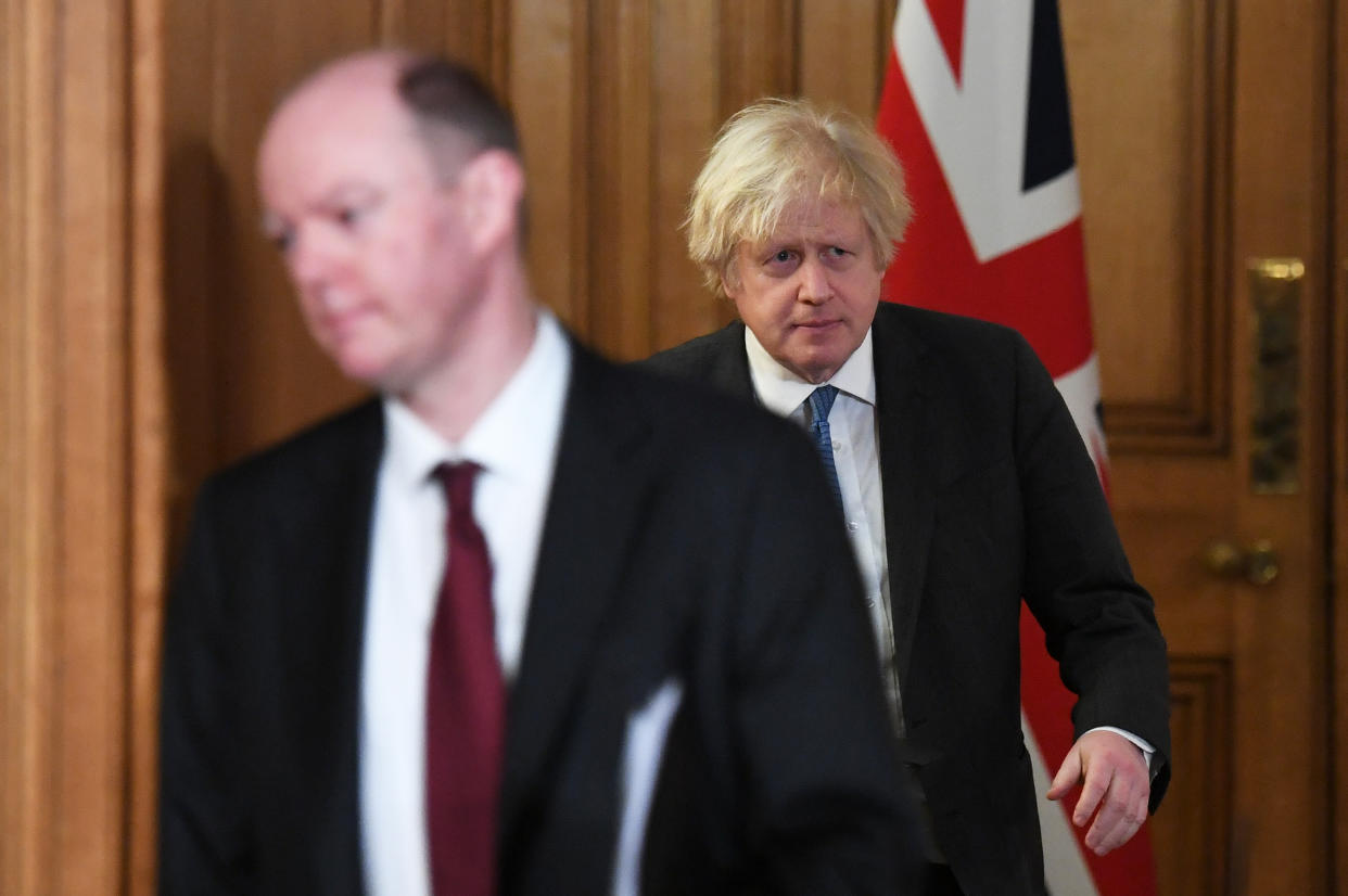 LONDON, ENGLAND - FEBRUARY 15: UK Prime Minister Boris Johnson (right) and UK Chief Medical Officer Chris Whitty arrive for a Covid-19 media briefing at Downing Street on February 15, 2021 in London, England. (Photo by Stefan Rousseau - WPA Pool/Getty Images)