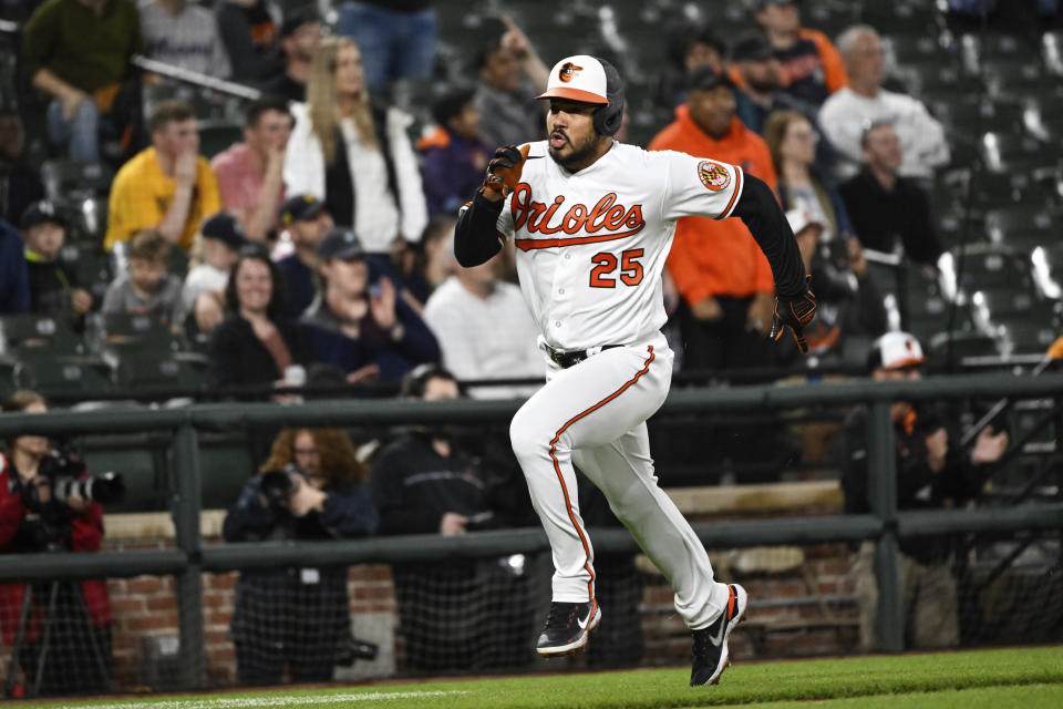 Baltimore Orioles' Anthony Santander heads home to score on a three-run double by Ramon Urias against the Detroit Tigers during the third inning of a baseball game, Saturday, April 22, 2023, in Baltimore. (AP Photo/Terrance Williams)