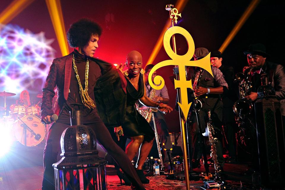 Prince and Shelby J perform onstage at The Hollywood Palladium on March 8, 2014 in Los Angeles, California.