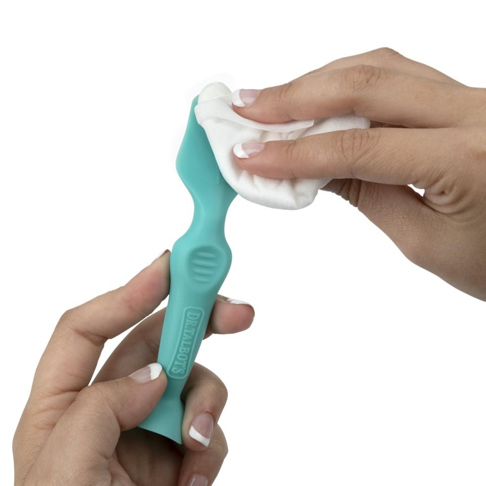 model holding blue baby paste brush