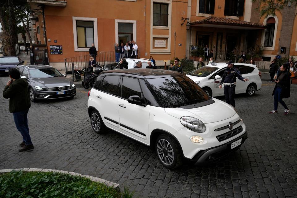 The car carrying Pope Francis leaves the Gemelli Isola Tiberina Hospital in Rome, Wednesday, Feb. 28, 2024. Pope Francis, who has been suffering from the flu, was brought to a hospital in central Rome aboard a small white Fiat 500 after the papal audience on Wednesday, leaving again in the same car after a short period. The Vatican had no immediate comment.