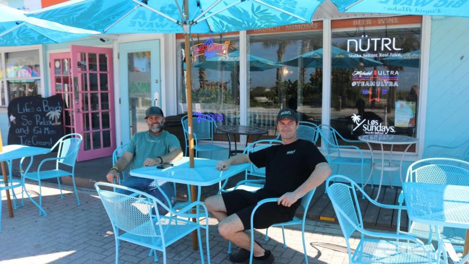 Guests at Wilder’s Slice of AMI, 103 Gulf Drive N., Bradenton Beach, may sit inside the dining room or take advantage of sidewalk seating facing onto beach dunes and the Gulf of Mexico. Shown above are partners Walter Loos, left, and Ryan Wilder. James A. Jones Jr./jajones1@bradenton.com