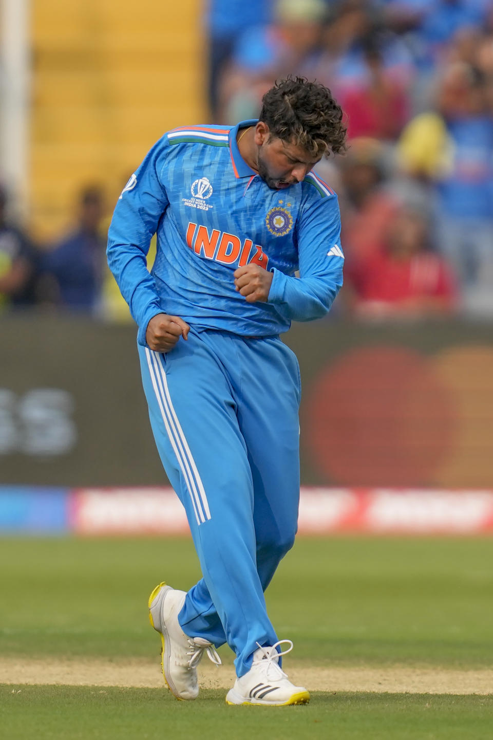 India's Kuldeep Yadav celebrates the dismissal of Bangladesh's Tanzid Hasan Tamim during the ICC Men's Cricket World Cup match between India and Bangladesh in Pune, India, Thursday, Oct. 19, 2023. (AP Photo/ Rafiq Maqbool)